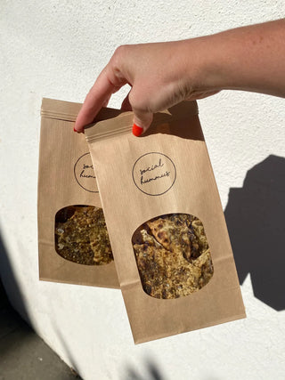 Hummus from Social Hummus - Classic OG, Black Sesame, Sunset Tomato & Basil Tahini and Lavash Crackers